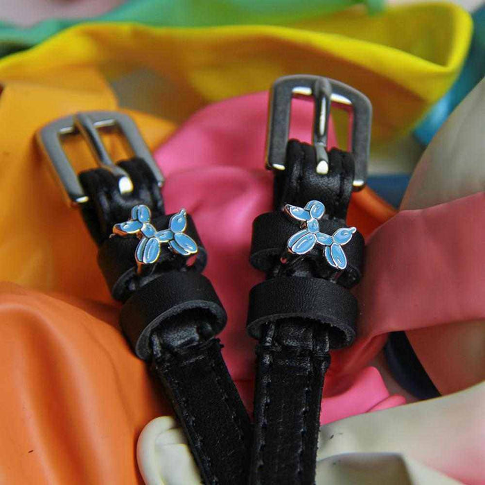 Balloon dog spur straps displayed on a bed of colorful balloons