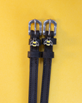 Black leather ManeJane bee spur straps with silver buckles and enamel bumblebee charms on yellow