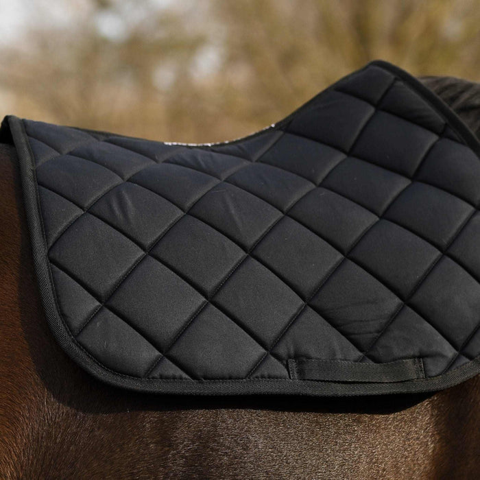 Close-up of the Not So Basic Black quilted saddle pad on a horse's back