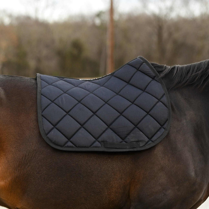 Not So Basic Black quilted black saddle pad on horse back