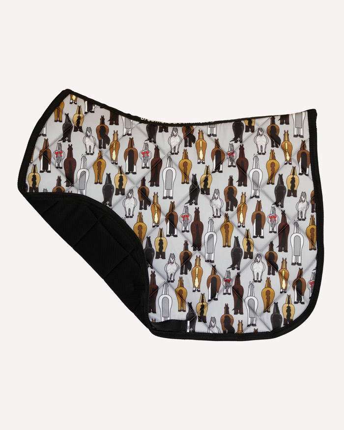Butts saddle pad, corner folded back to show the black non-slip underside by Dreamers & Schemers