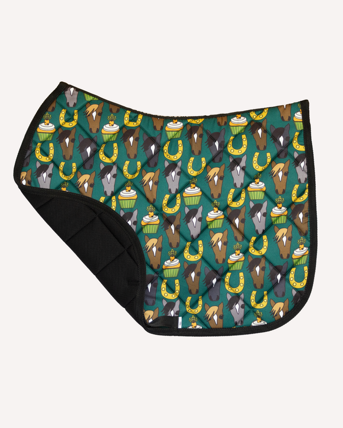 Carrot Cake saddle pad, corner folded back revealing the black grippy underside by Dreamers & Schemers
