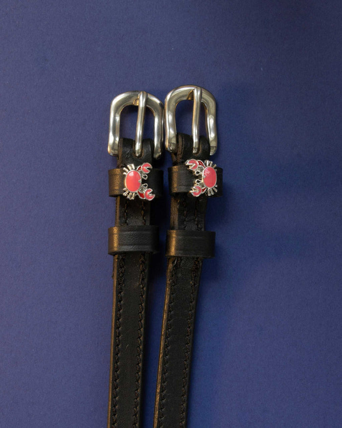 Crabbin' ManeJane spur straps with the signature Crabbin' charm, shown on a navy background