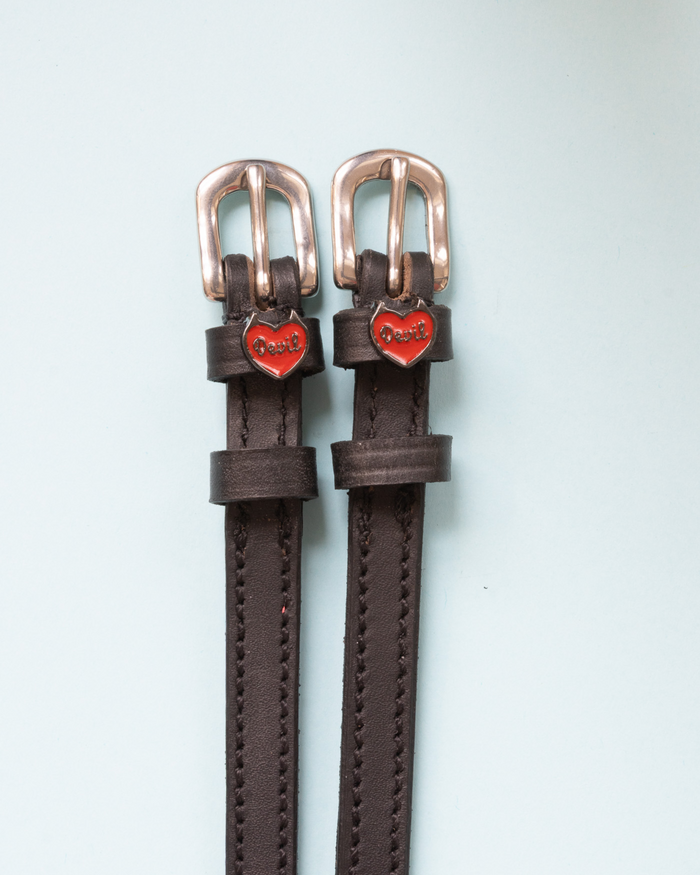 Dark brown leather Devil heart spur straps with rose gold buckles on pale mint