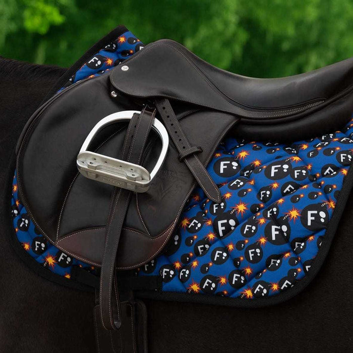Ultimate F-Bomb Pack dressage saddle pad with black leather saddle and stirrup on horse