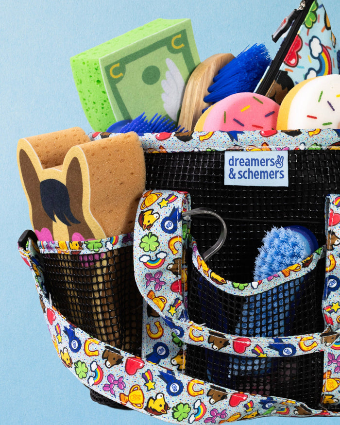 Feeling Stable grooming tote filled with grooming supplies, woven dreamers & schemers label in view