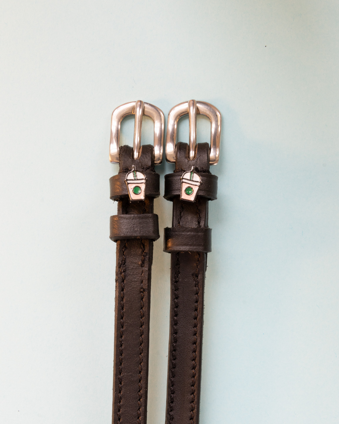 Dark brown leather spur straps with frappe cup charms and silver buckles