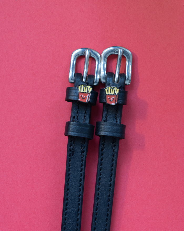 Black leather ManeJane French Fries spur straps with silver buckles and fry-carton charms