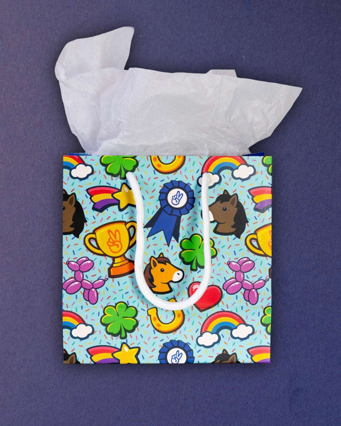 Full O' Luck small gift bag front-on, square aqua panel of horseshoes, hearts and balloon ponies.
