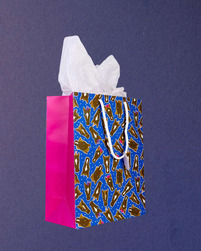 Hairy Styles medium gift bag at three-quarters, pink gusset on the left and horse heads across the front.