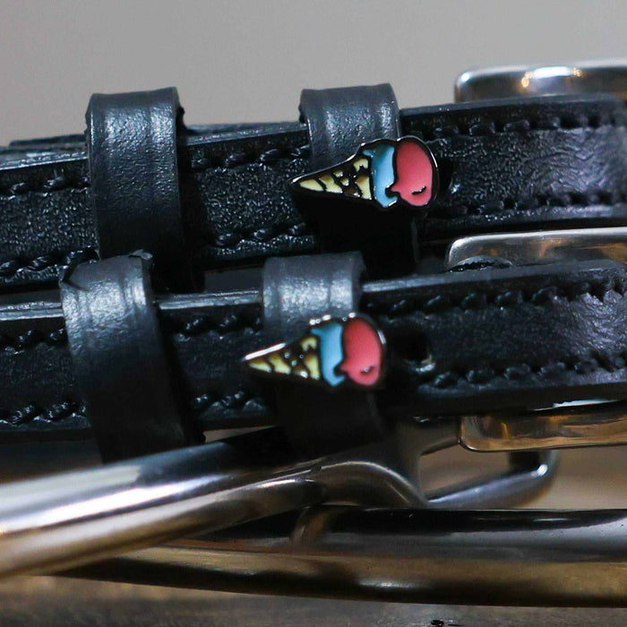 Close-up of ice cream cone charms on black leather ManeJane spur strap keepers