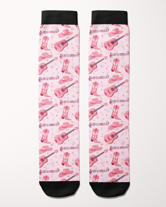 Dolly Forever socks in light pink, full pattern of cowgirl boots, guitars, hats and music notes
