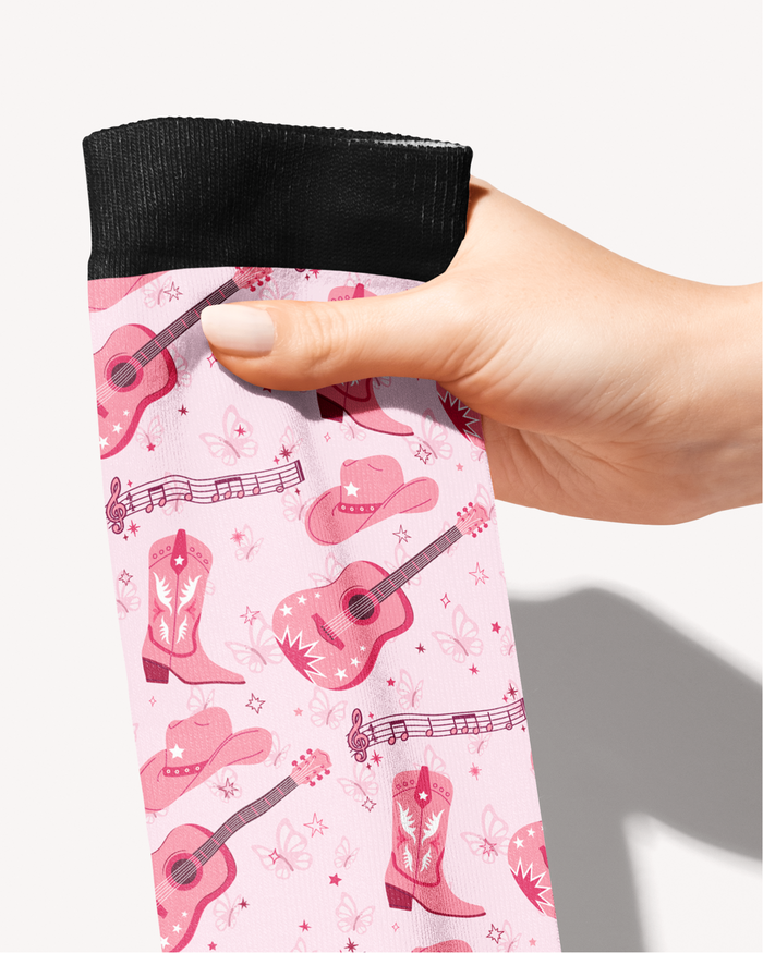 Close-up of the Dolly Forever print — pink guitars, cowgirl boots and hats, by Dreamers & Schemers