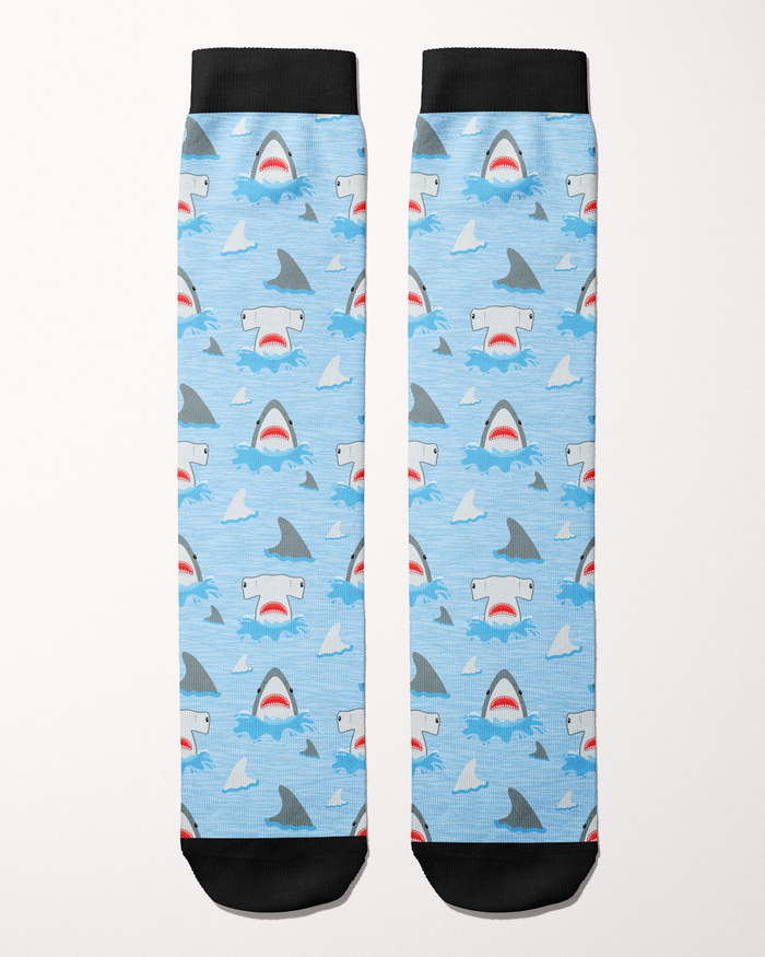 Shark Week Limited Edition equestrian boot socks in blue, flat lay showing the shark-and-fin pattern, by Dreamers & Schemers