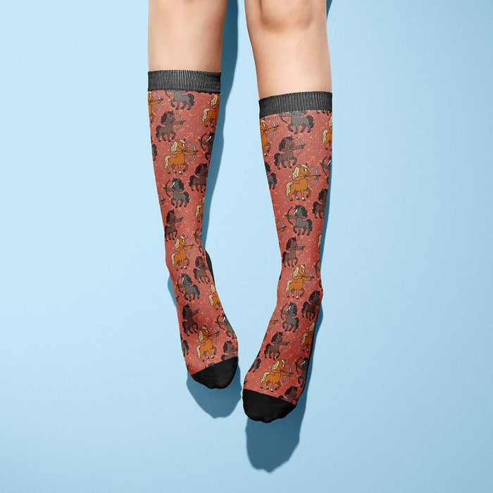 Sagittarius zodiac horseback riding boot socks with horse pattern on rust background
