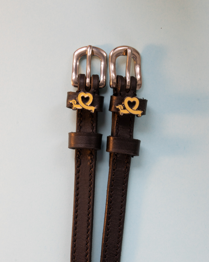 Brown Long Dogs spur straps with rose-gold buckles and dachshund-heart charms, ManeJane