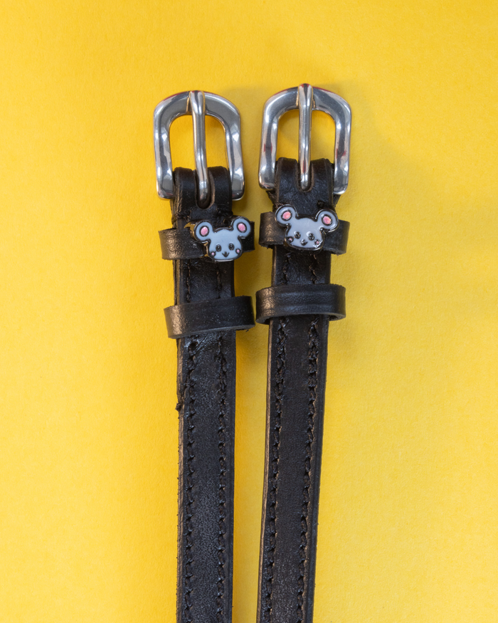 Black leather ManeJane Mouse spur straps with silver buckles and grey mouse charms on yellow