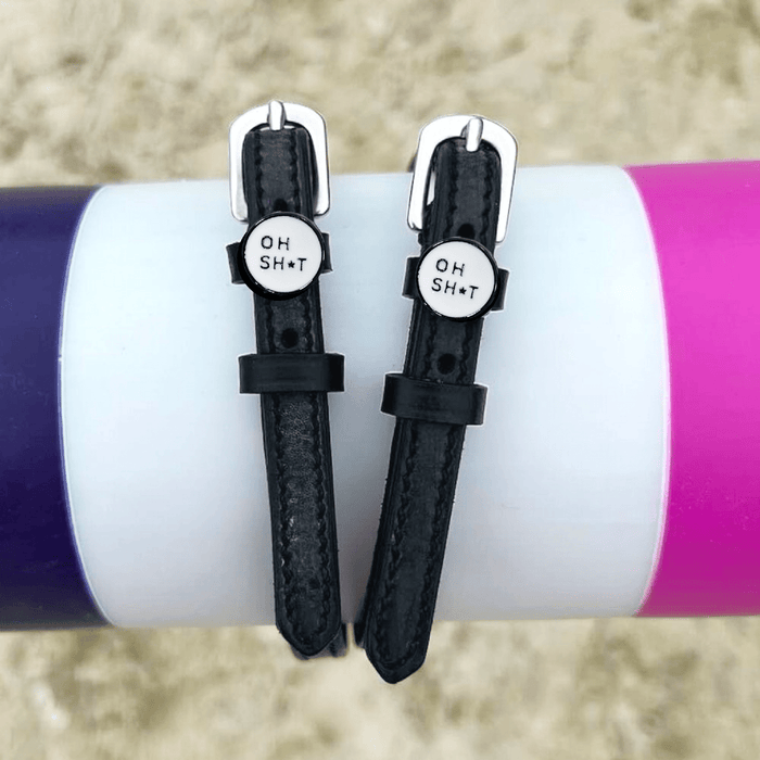 ManeJane OH SH*T spur straps wrapped around a colorful tumbler, lifestyle shot