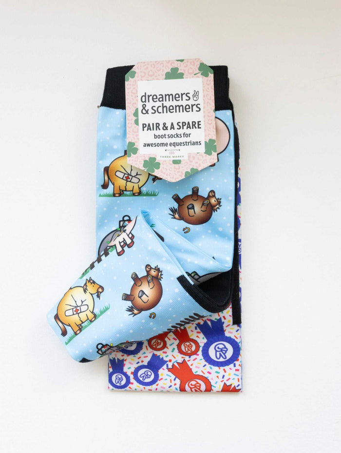 Pasture Ornaments boot socks shown folded with the included spare sock and printed cuff detail