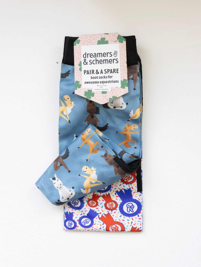 Pony Pilates boot socks shown folded with the included spare sock and printed cuff detail