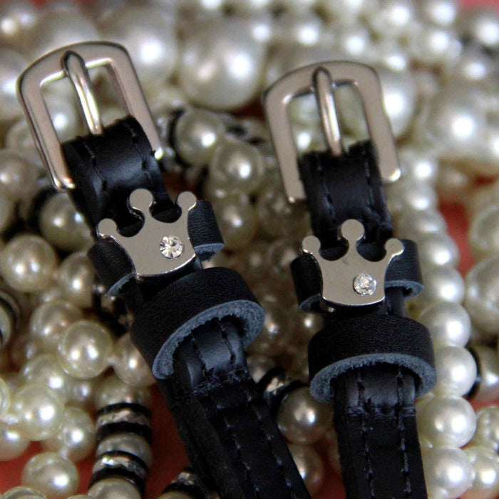 Queenie crown spur strap buckle ends styled on a bed of pearls
