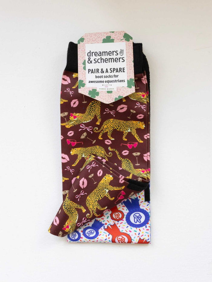 Ready to Play boot socks shown folded with the included spare sock and printed cuff detail