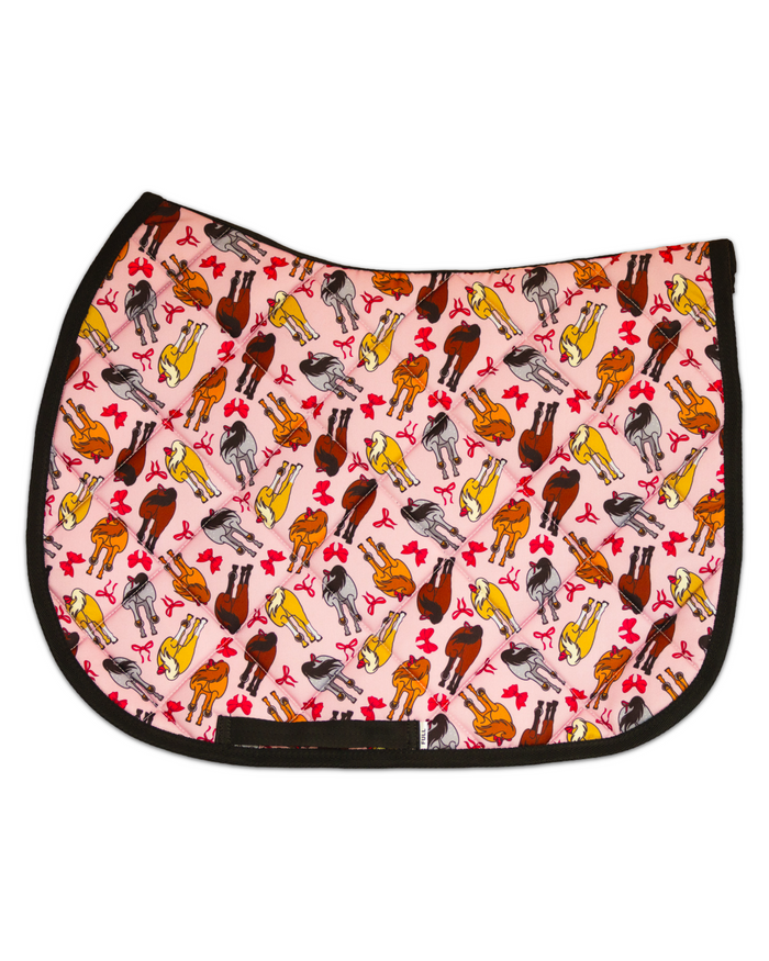 Red Ribbon Girlies patterned saddle pad, full top view of the print and contrast binding, by Dreamers & Schemers