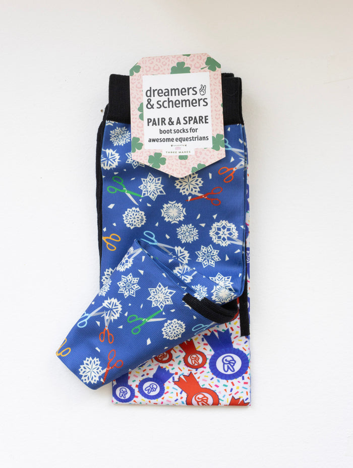 Shear Magic boot socks shown folded with the included spare sock and printed cuff detail