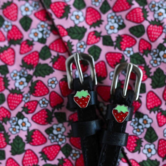 Strawberry spur straps on a pink strawberry-print fabric, ManeJane enamel charm detail