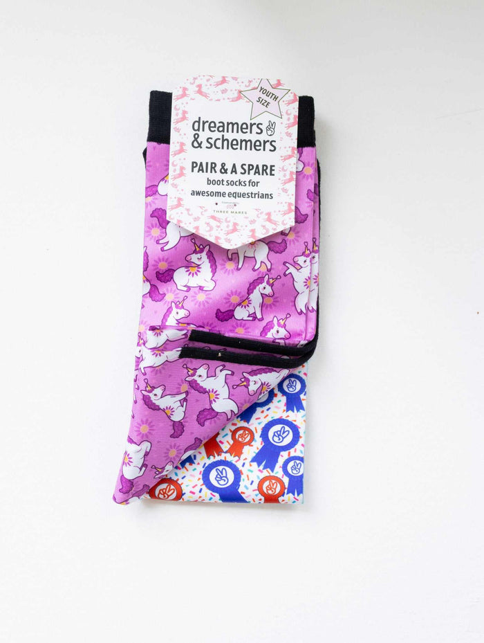 Sunshine and Unicorns youth boot socks shown folded with the included spare sock and patterned cuff