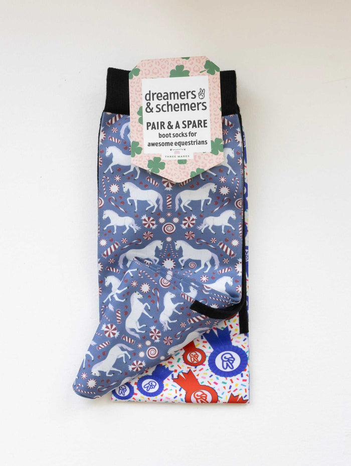 The Pony Island Peppermint Ponies boot socks shown folded with the included spare sock and printed cuff detail