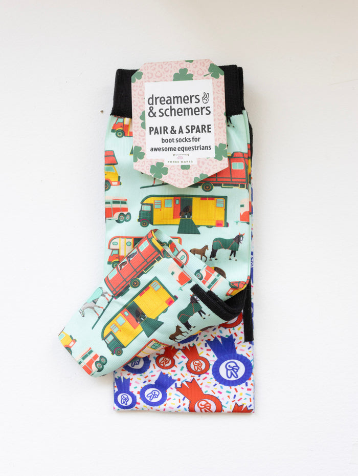 The Pony Island Retro Trailers boot socks shown folded with the included spare sock and printed cuff detail