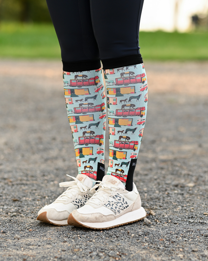 The Pony Island Retro Trailers riding boot socks styled over breeches, mint green with vintage horse trailers