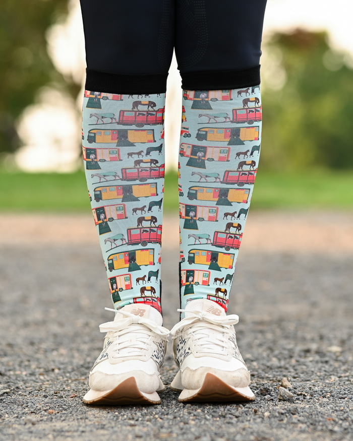 The Pony Island Retro Trailers equestrian boot socks worn at the barn, mint green with vintage horse trailers