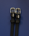 Black leather ManeJane spur straps with three-crystal charms and silver buckles on navy