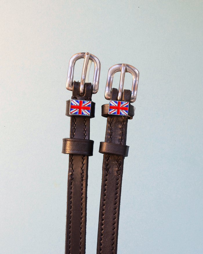 Brown leather ManeJane spur straps with enamel Union Jack flag charms on pale mint