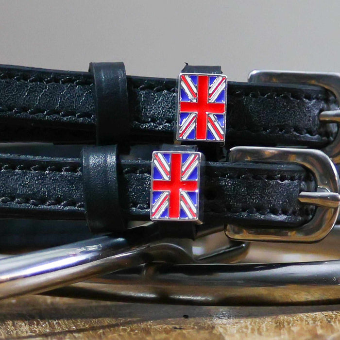 Close-up of enamel Union Jack flag charms on black leather spur strap keepers